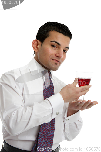 Image of man presenting a glass of wine