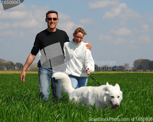 Image of couple and dog