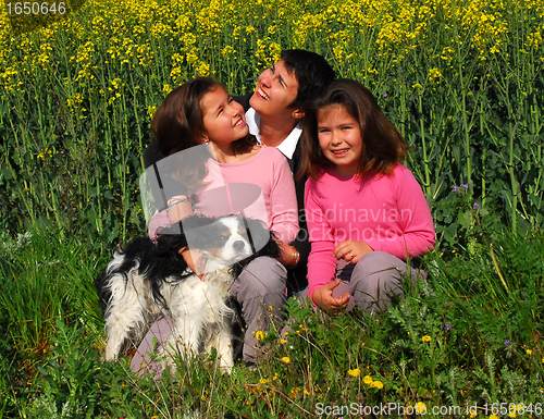 Image of family and dog