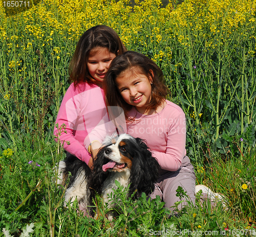 Image of twins and dog