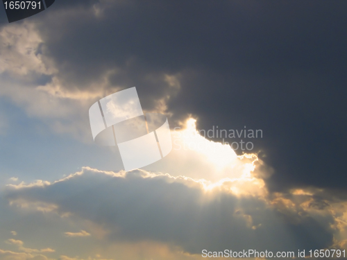 Image of rain cloud and rays of sunlight