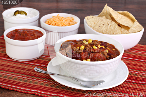 Image of Taco Soup with assorted condiments