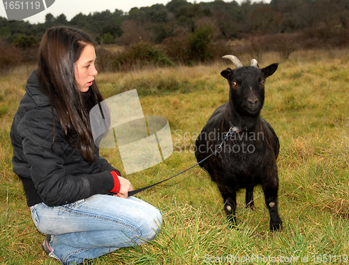 Image of teen and goat
