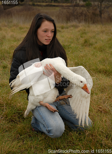 Image of teenager and goose