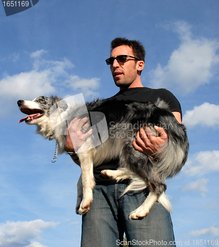 Image of man and border collie