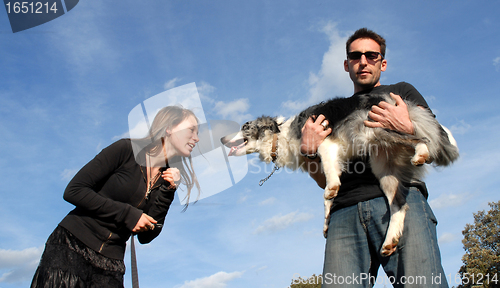 Image of couple and dog
