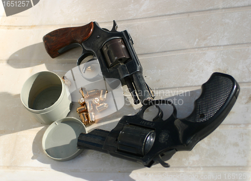 Image of two guns