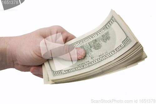 Image of Male hand holding sheaf of dollar notes isolated on white