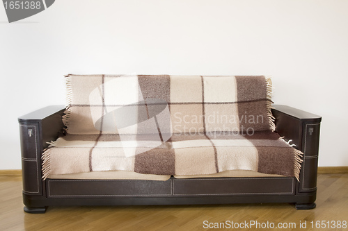 Image of classic sofa on the wooden floor