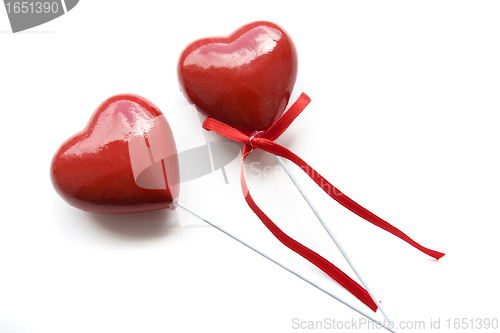 Image of Two plastic souvenir hearts isolated