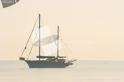 Image of Sailboat sailing in the evening