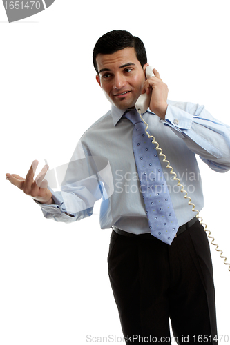 Image of Businessman salesman talking on the phone