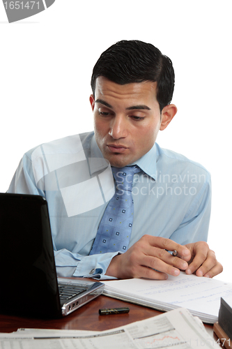 Image of Businessman at desk working