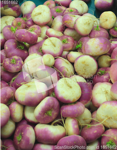 Image of lots of fresh turnips on a market stall