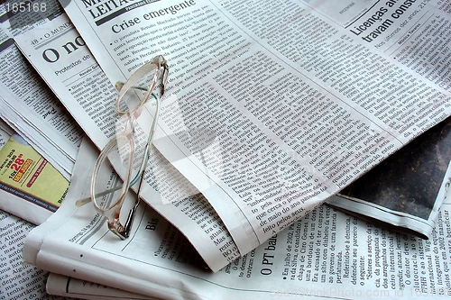 Image of Newspaper and the glasses