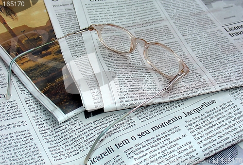 Image of Newspaper and the glasses