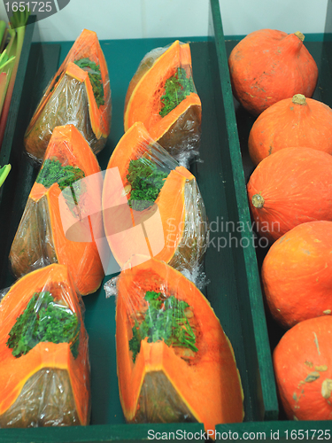 Image of fresh and colorful pumpkins on a market stall