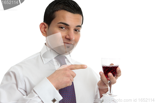 Image of Man showing or presenting wine