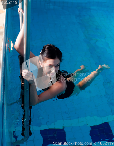 Image of Attractive girl in swimming pool