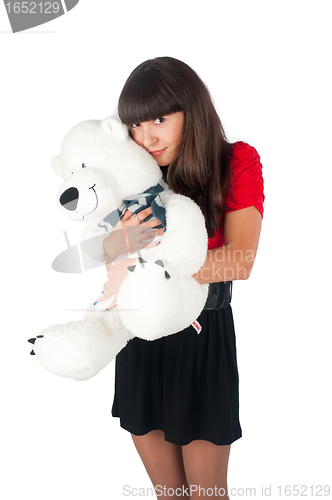 Image of Pretty girl with bear toy