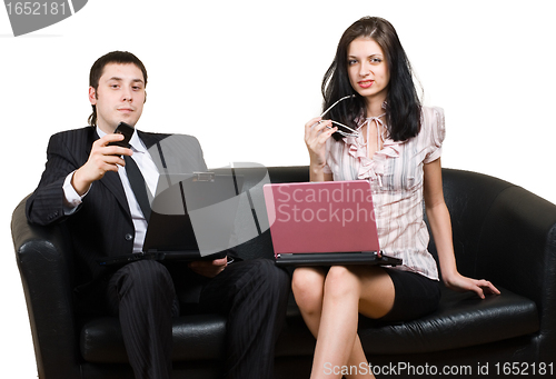 Image of Businessmen with computers on sofa