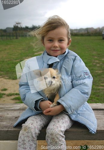 Image of child and chihuahua