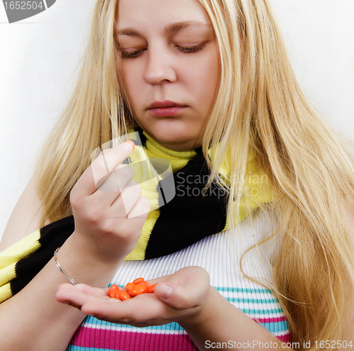 Image of girl with pills.treatment