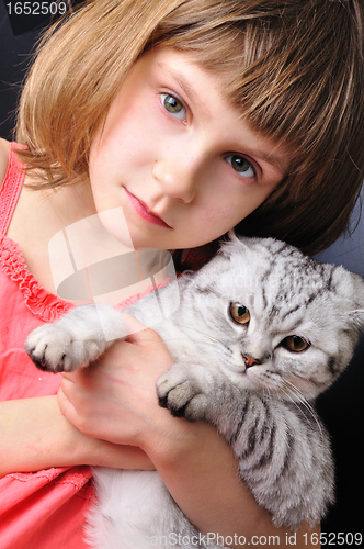 Image of child with her pet cat