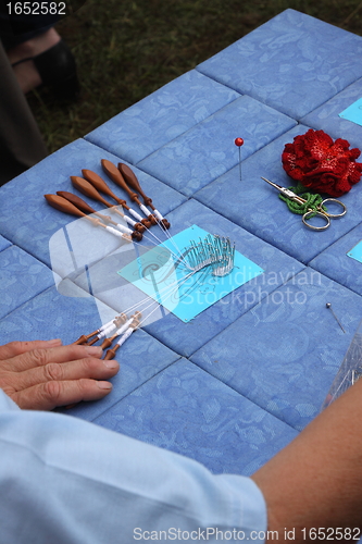 Image of Process of lace-making with bobbins 