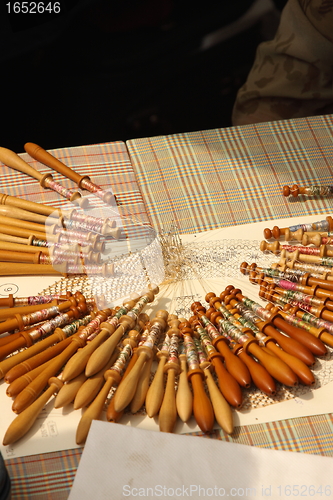 Image of Process of lace-making with bobbins 