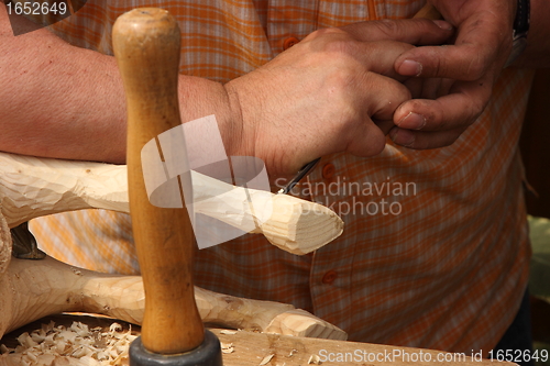 Image of wood carving sculpture of a wooden horse