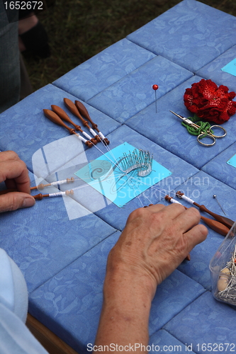 Image of Process of lace-making with bobbins 