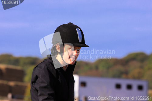 Image of portrait of a young rider before a contest