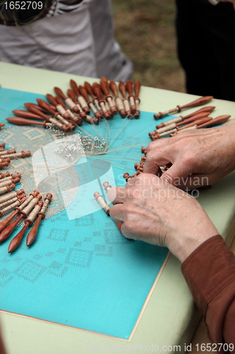 Image of Process of lace-making with bobbins 