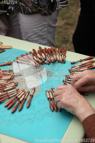 Image of Process of lace-making with bobbins 