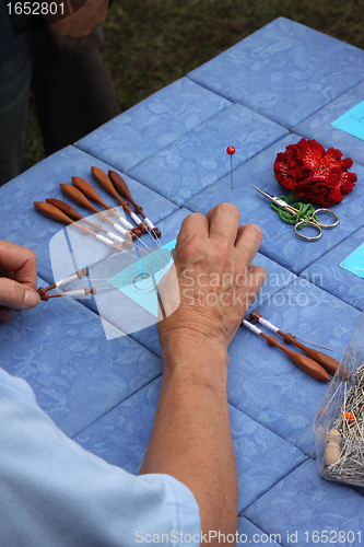 Image of Process of lace-making with bobbins 