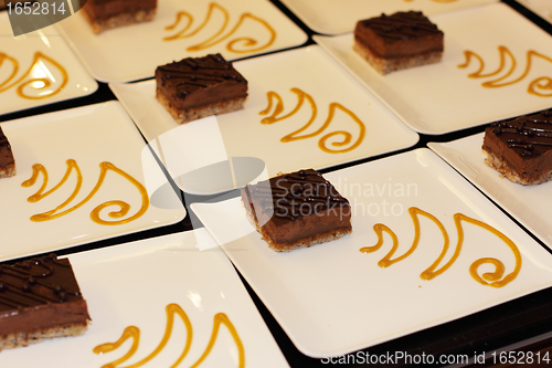 Image of preparation of dessert plates for a chocolate cake louis XV