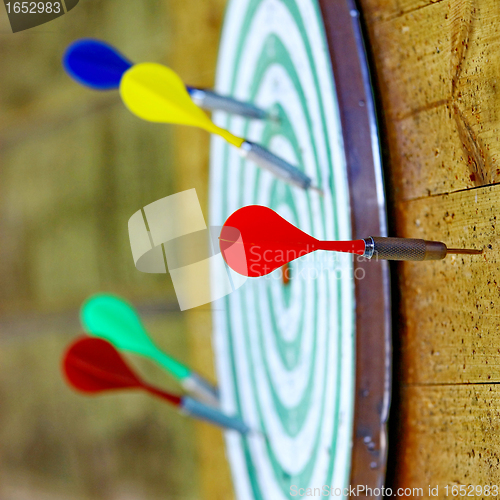 Image of  Colorful darts on dartboard