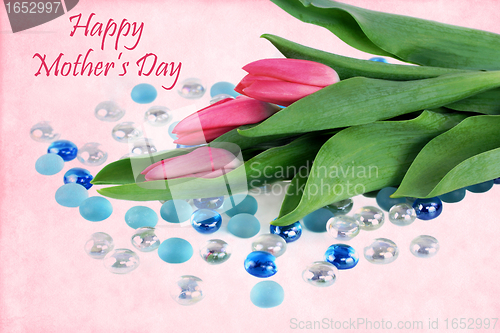 Image of Beautiful tulips with a vintage background and a Mother's Day wi