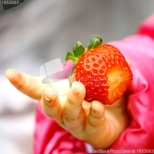 Image of  Child Tasting Strawberry Fruit