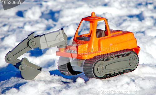 Image of Toy excavator on the snow