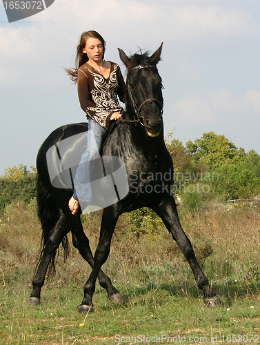 Image of young woman and horse