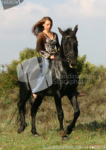 Image of young woman and horse