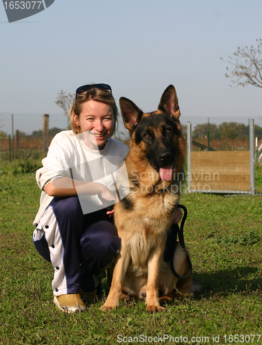 Image of german shepherd and girl