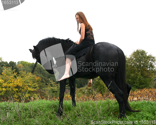 Image of young woman and horse