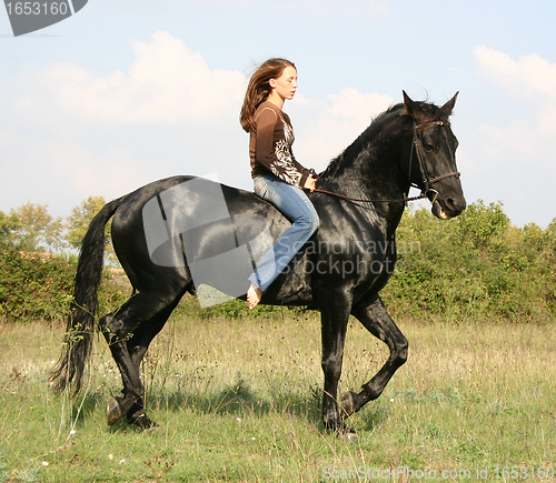 Image of young woman and horse