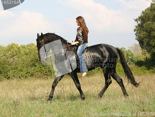 Image of young woman and horse