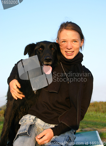 Image of teen and belgian shepherd