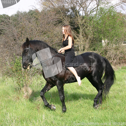 Image of young woman and horse