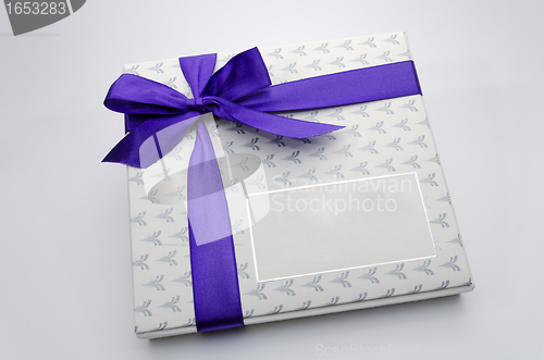 Image of Printed over a purple ribbon gift box